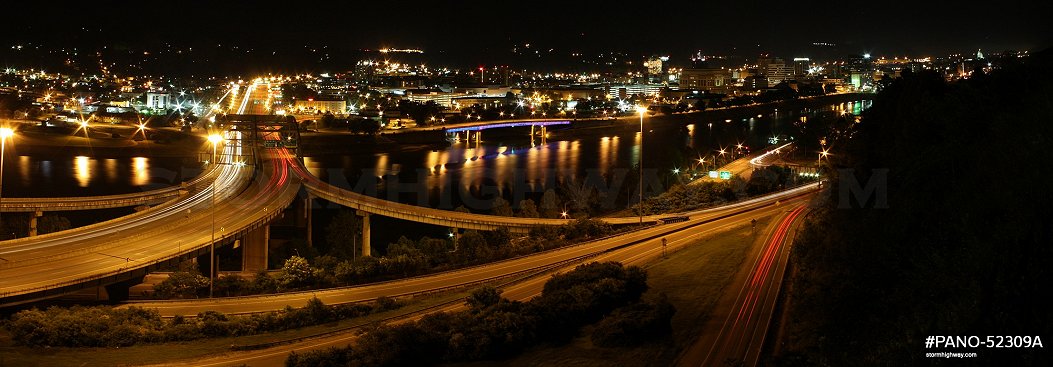 Panoramic image of Fort Hill Bridge and downtown Charleston at night