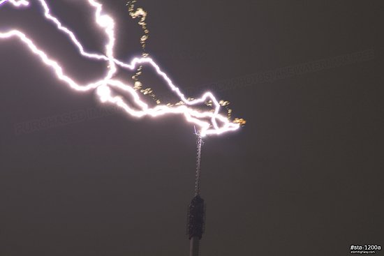Close-up of lightning striking a TV tower