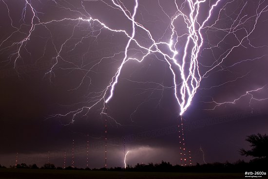 Lightning strikes TV towers at night