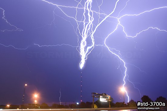 Lightning strikes a TV tower at night 