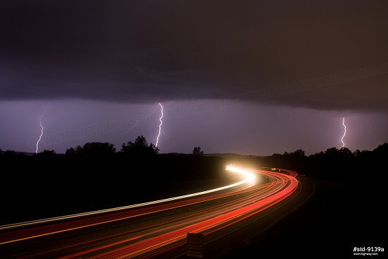 Lightning over Interstate 44 traffic streaks near Eureka, Missouri.