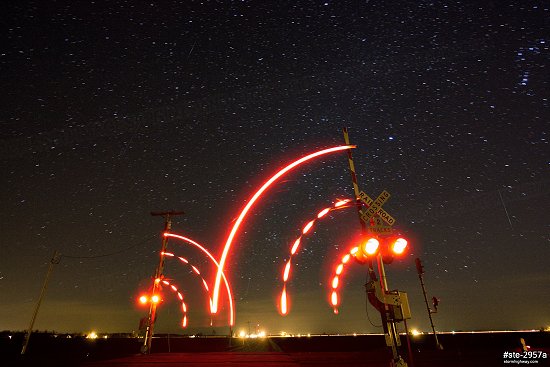 Geminid meteors over a railroad crossing in rural Illinois in December of 2012