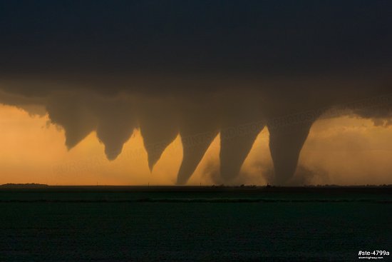 Digital composite image showing the developing stages of a tornado at sunset near Rozel, Kansas
