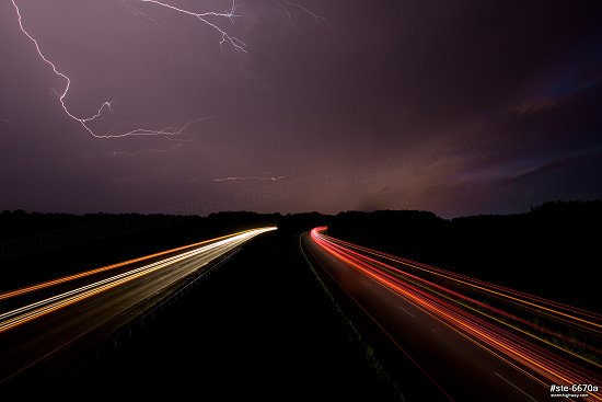 Lightning over Interstate 64 traffic near Wayne City, Illinois