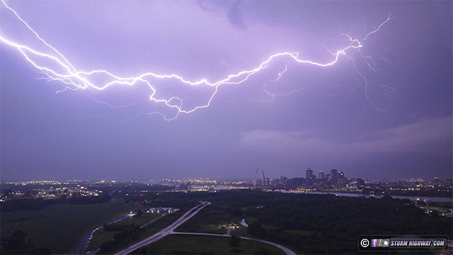 Aerial view of lightning over Arch and downtown