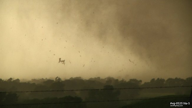 Flying debris as an EF4 tornado hits a structure near Abilene, Kansas
