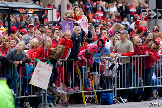 young fans eagerly await the parade